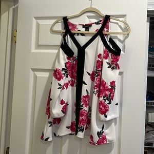 Floral blouse cut out shoulders and mid length sleeves.